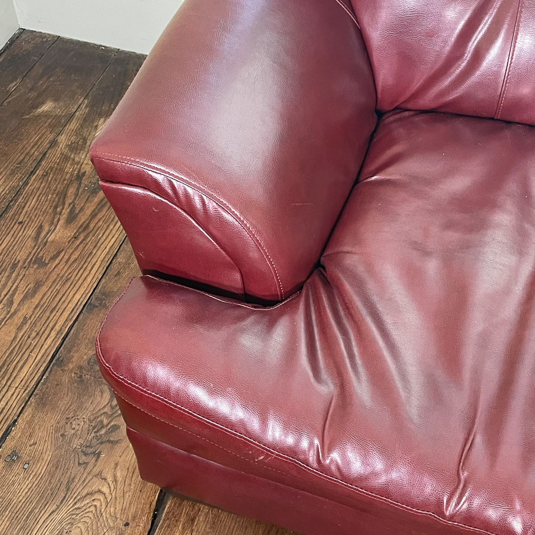 RED LEATHER LOVESEAT