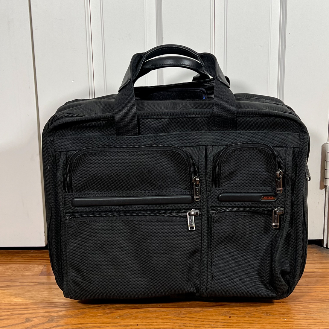 TUMI ROLLING BRIEFCASE