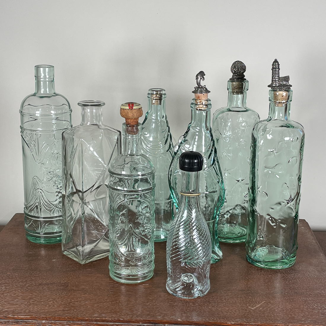 (8pc) MOLDED GLASS BOTTLES