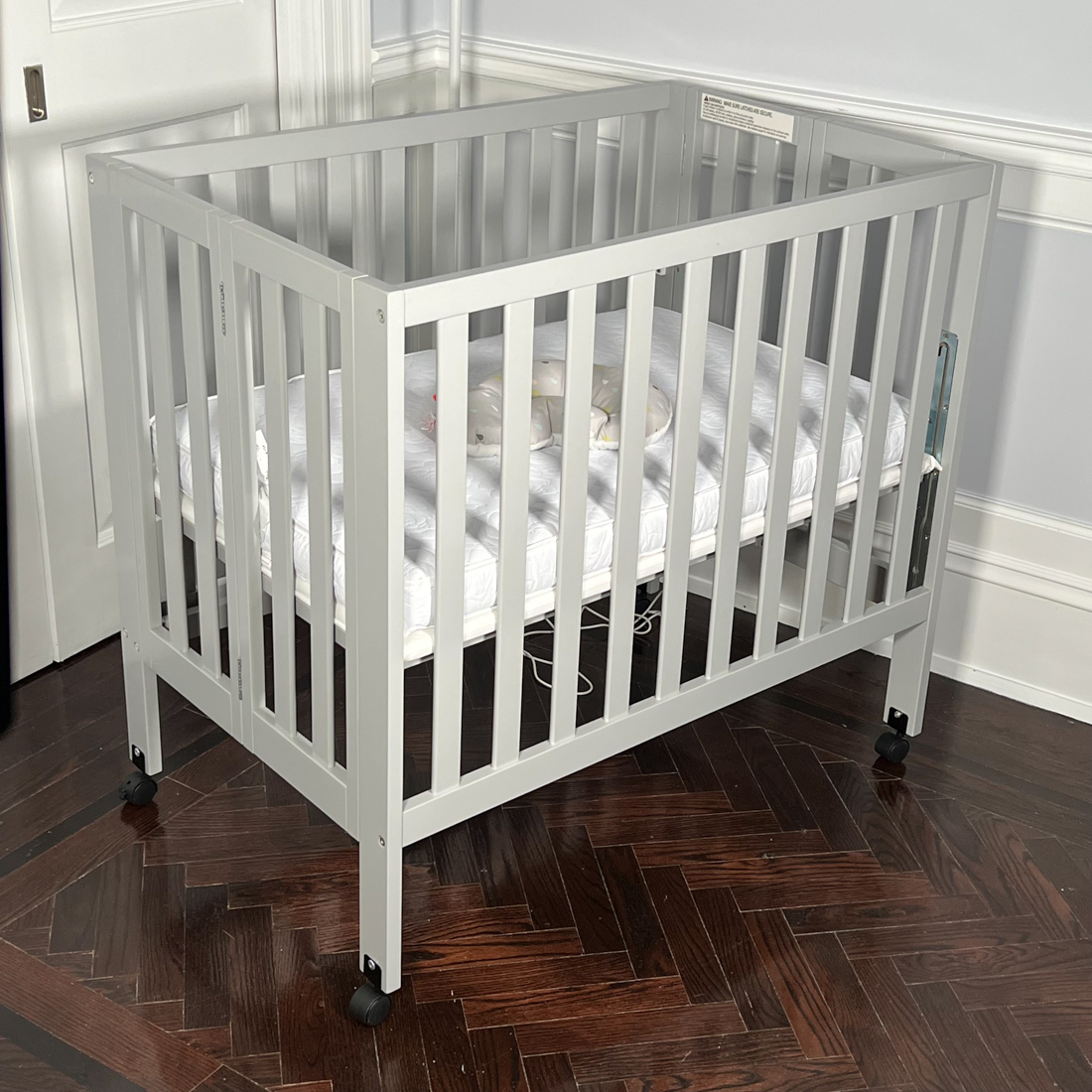GRAY FOLDING CRIB